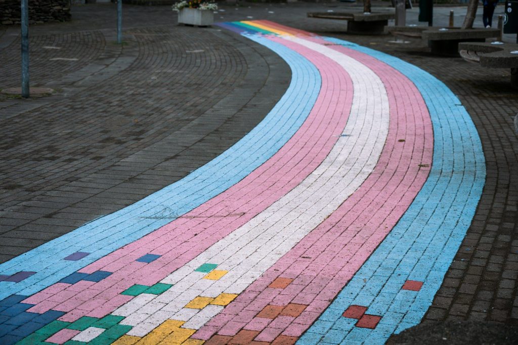 Transgender pride flag painted on a curved walkway